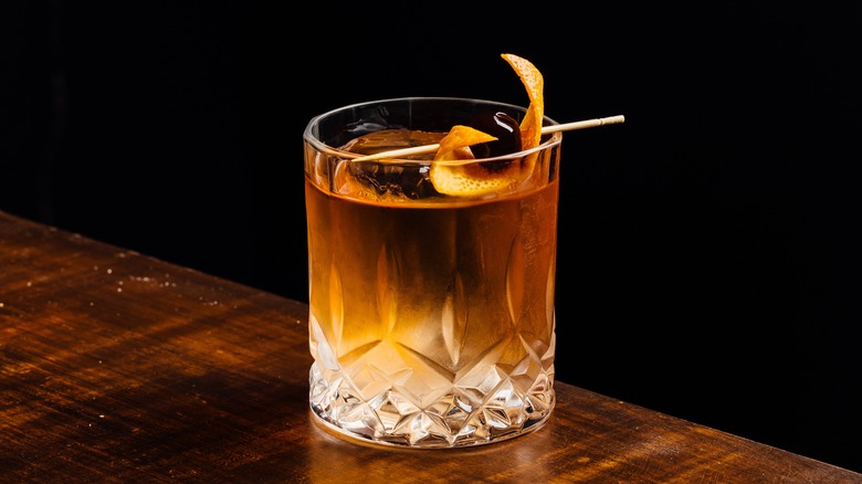 Old fashioned cocktail with cherry