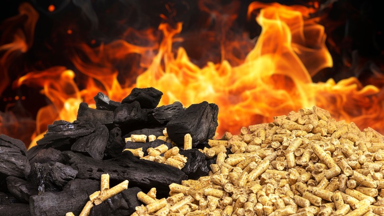 Charcoal and wood pellets in fire