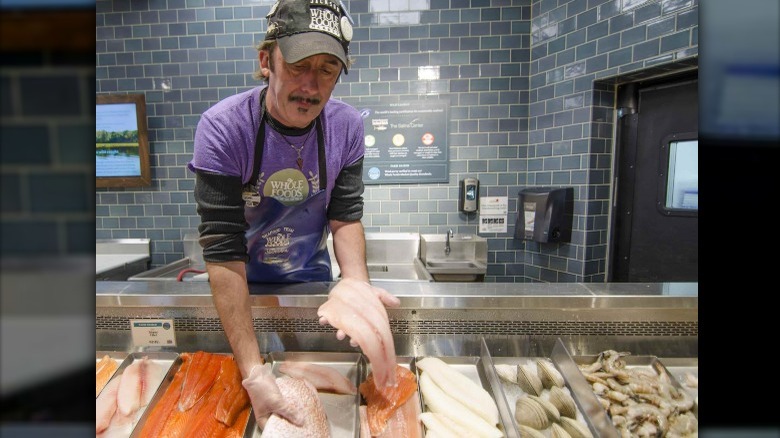 fishmonger at  Whole Foods seafood counter