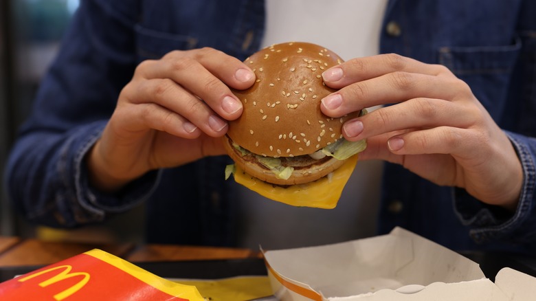 Person eating McDonald's burger