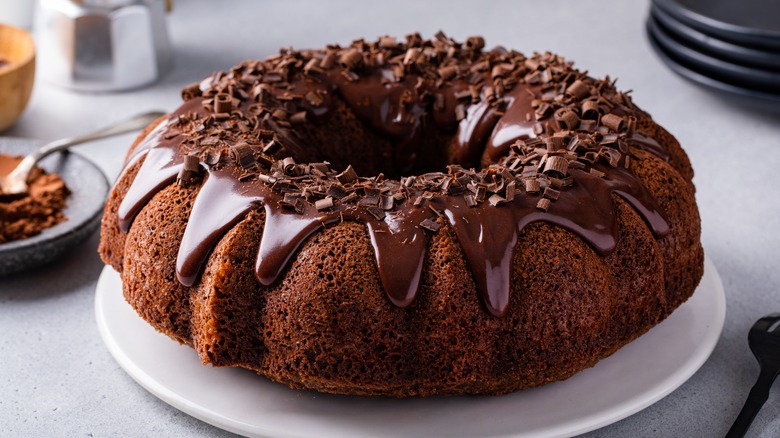 chocolate bundt cake with icing on a plate