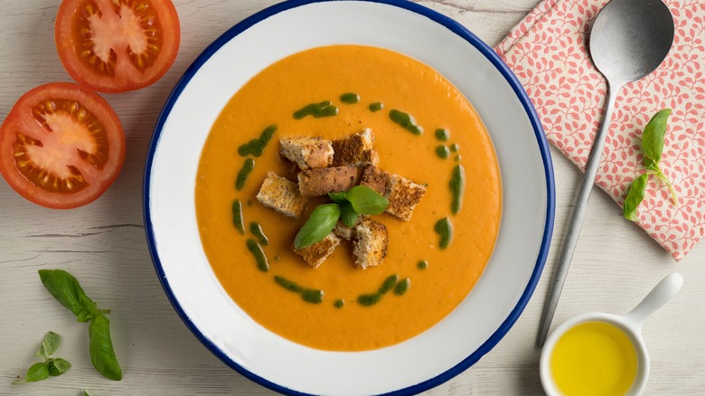 Tomato soup with basil oil and croutons