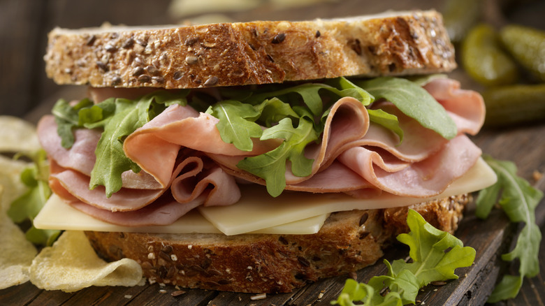 ham sandwich with arugula and cheese