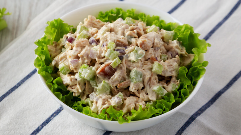 Chicken salad in bowl with lettuce