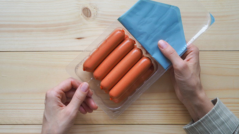 Open package of raw hot dogs