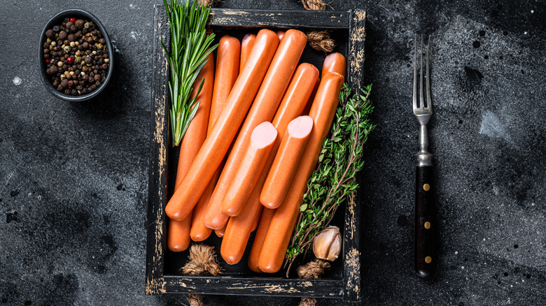 Raw hot dogs with herbs