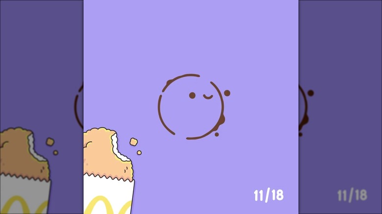 On a purple background, an animated, half-eaten hashbrown is in one corner, with the date 11/18 in the other in white lettering. A coffee ring with a smiley face inside it is in the middle.