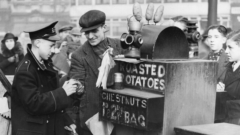 1936 picture of a roasted potato vendor in London