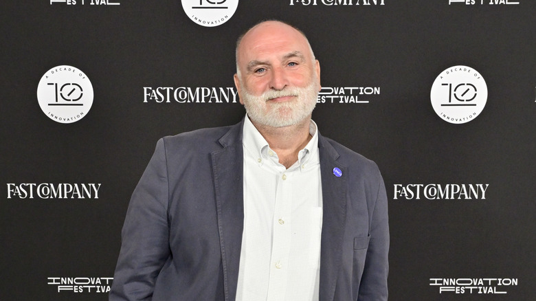 Chef José Andrés smiling on red carpet.