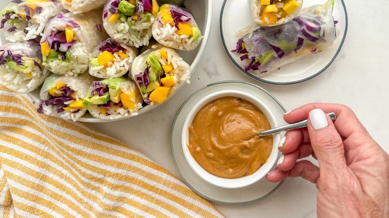 hand stirring peanut sauce