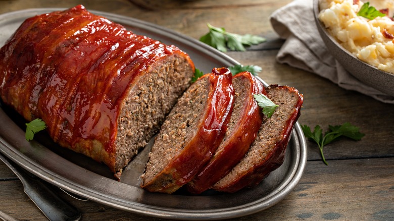 Meatloaf on a serving plate with parsley