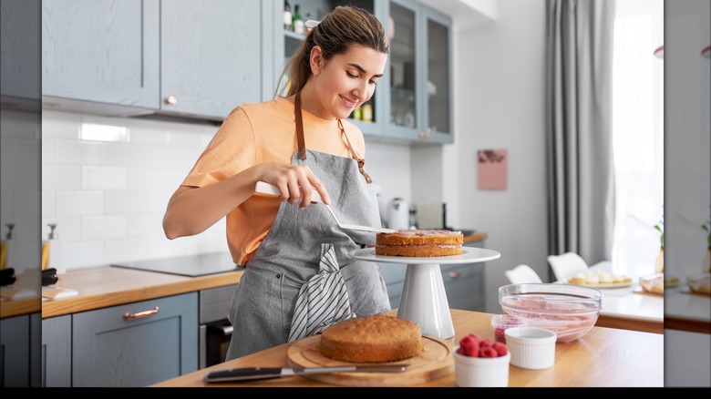 woman making layer cake