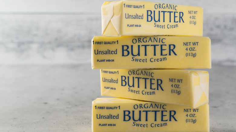 Four sticks of butter stacked on the counter