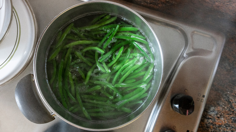 Green beans boiling in a pot