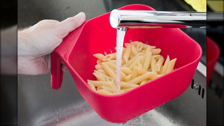 rinsing pasta with water