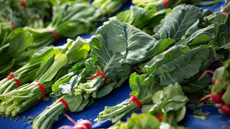 Bunches of collard greens at the grocery store