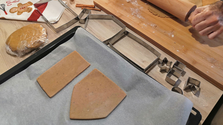 Cut gingerbread dough on a baking sheet