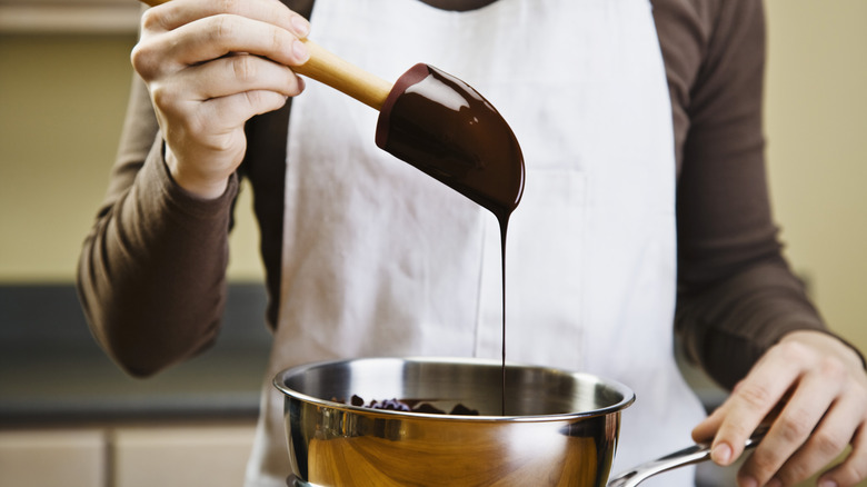 A person melting chocolate