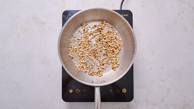 pine nuts in skillet