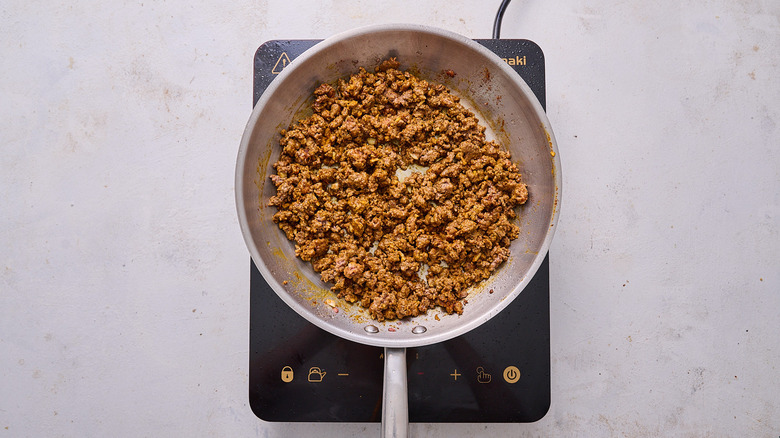 seasoned lamb in skillet