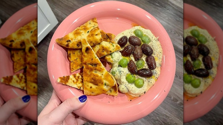 Hummus with olives and pita snack on a Chunky Plate