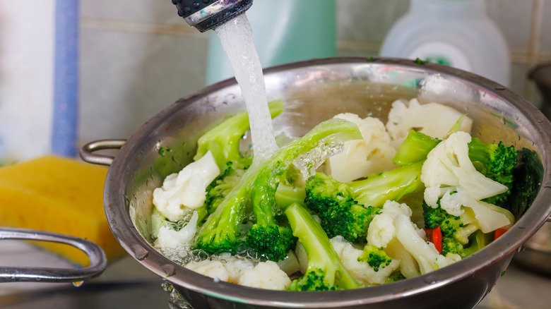 Chopped vegetables getting rinsed