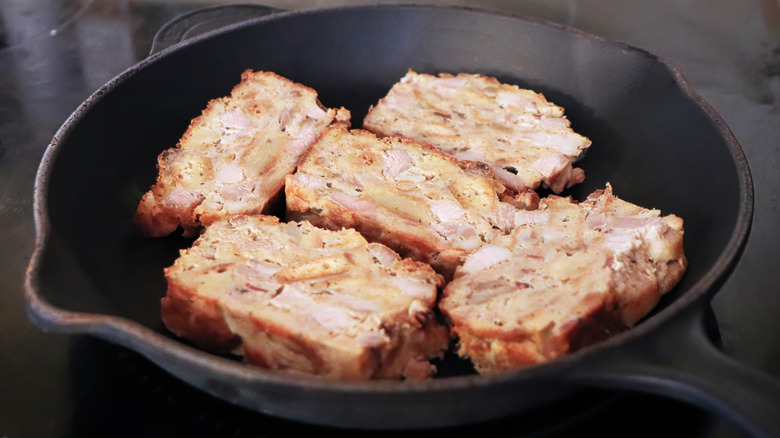 Scrapple frying in a pan