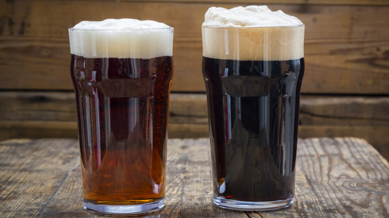 Two dark beers on wooden table