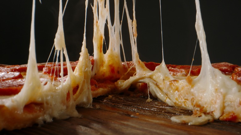 Cheese pull on a pizza
