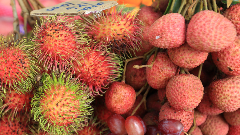 Lychees and rambutans on a fruit stall