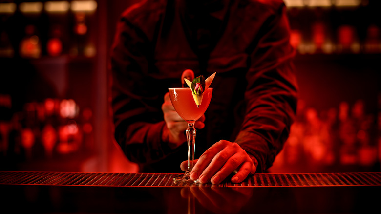 Bartender presenting cocktail