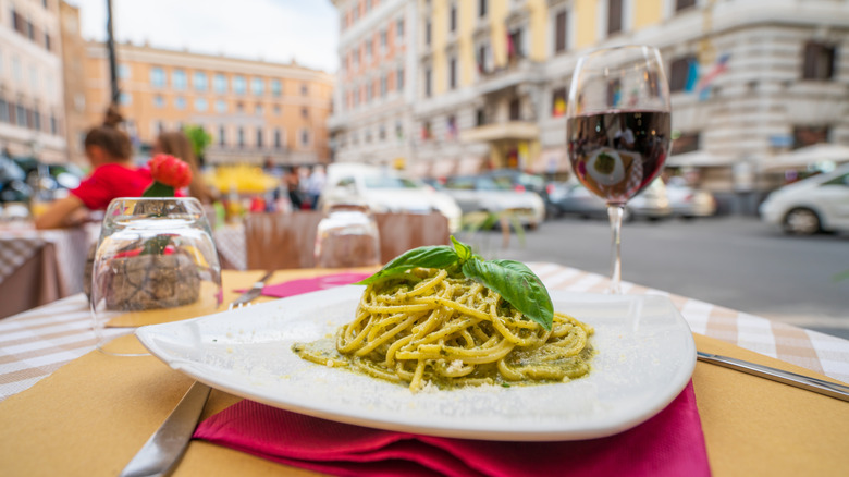 Pesto pasta and red wine in Italy