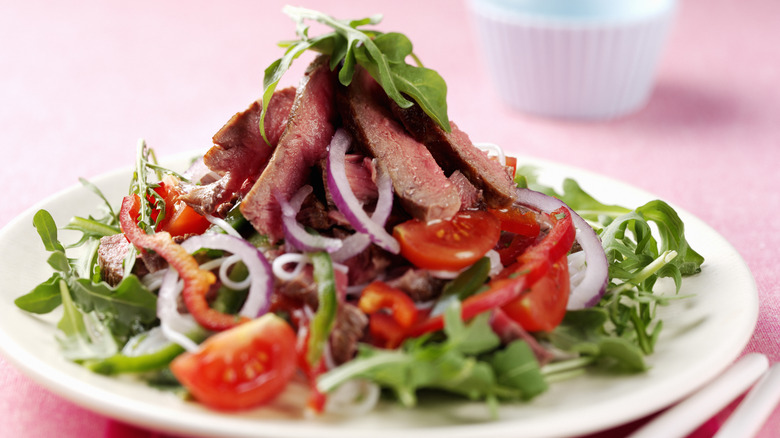 steak salad on white plate