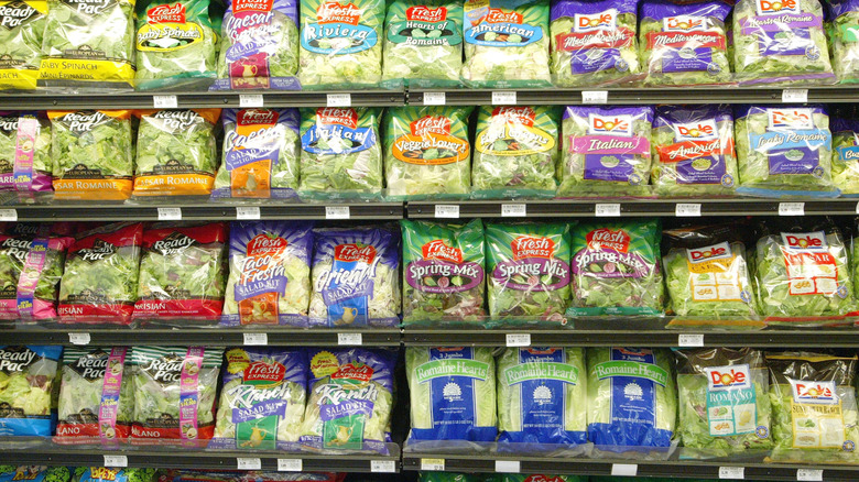 Salad kit bags in grocery store