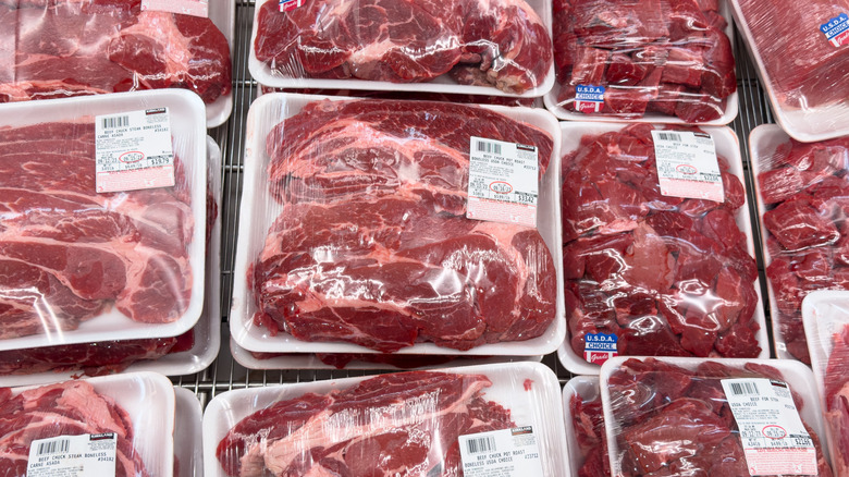 packages of steak in costco meat section with labels