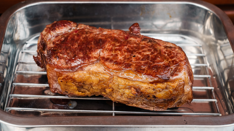 Steak resting on a wire rack