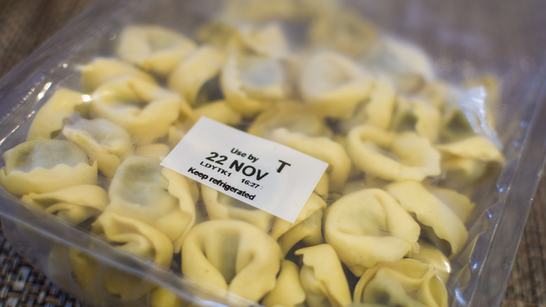 package of pasta tagged with a use-by sticker