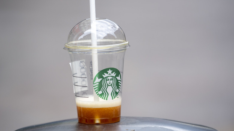 Nearly empty Starbucks plastic cup