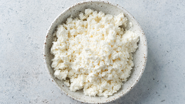 Bowl of cottage cheese with a view from above on a countertop.