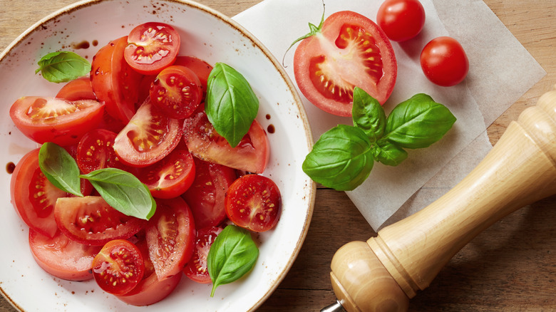 Sliced tomatoes with basil