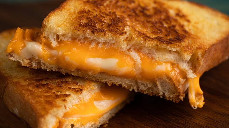 Grilled cheese sandwich on dark background