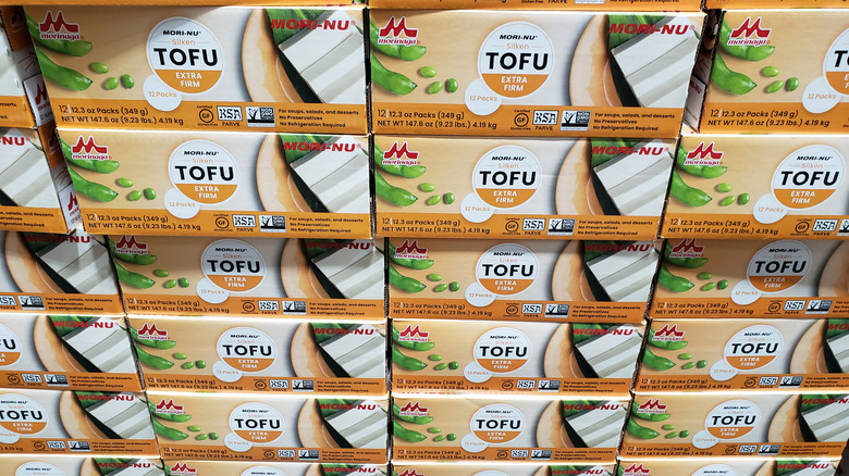 Stacks of silken tofu on a shelf