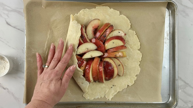 folding dough edges over peaches