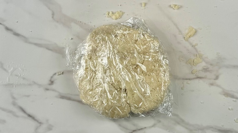 plastic wrapped dough disk