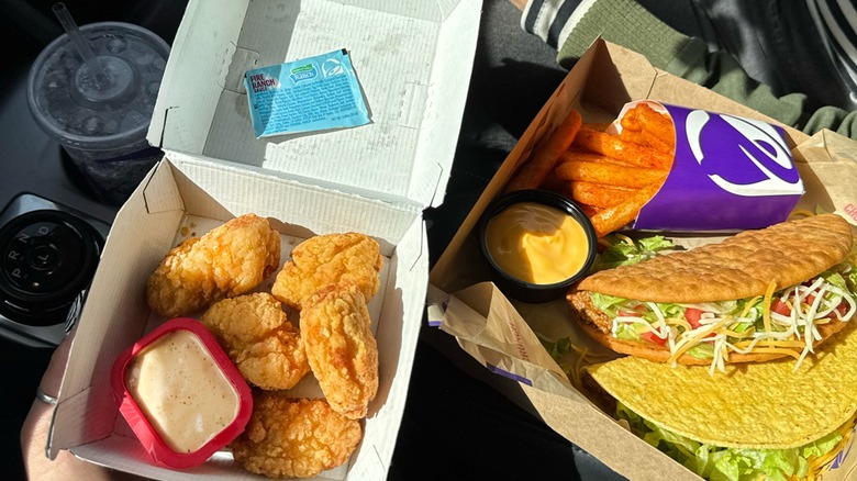 Taco Bell nuggets and combo meal on car seat