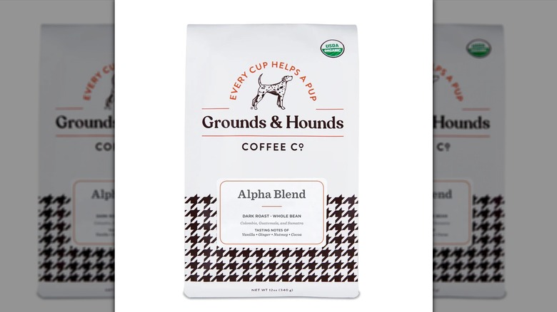 a close up of the packaging for Grounds & Hounds Alpha Blend dark roast coffee