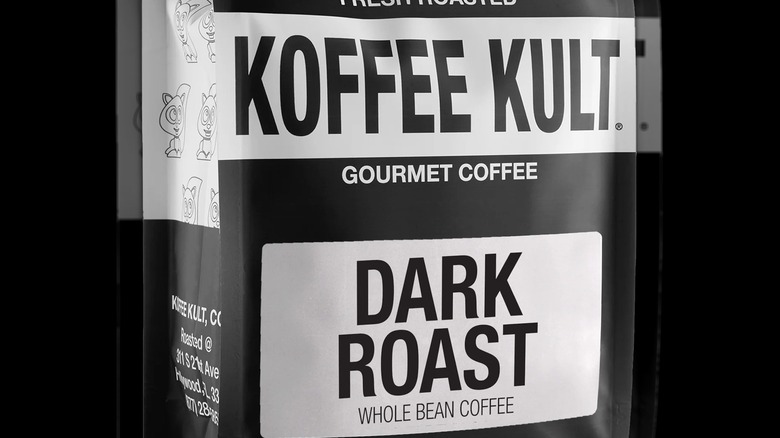 An extreme close up on a packet of Koffee Kult's dark roast gourmet coffee