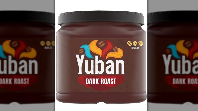 A front-on view of a tub of Yuban dark roast coffee