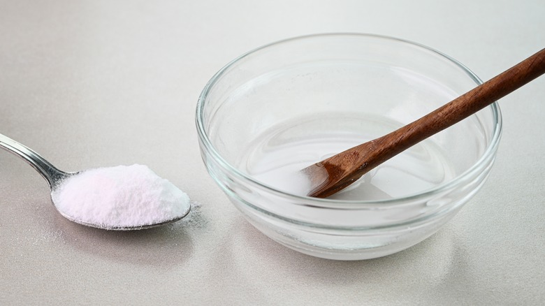 Baking soda in a bowl with a spoon
