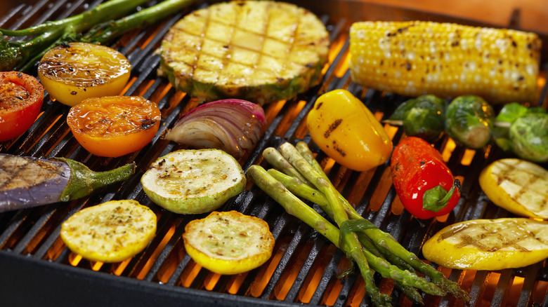 Various vegetables on flaming grill